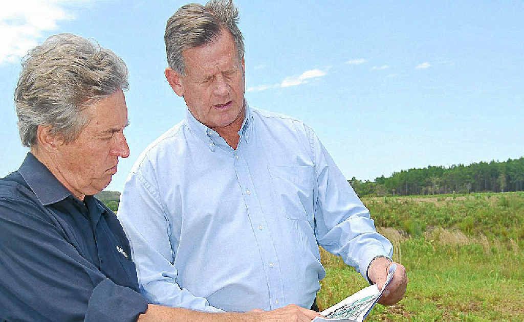 Leda regional manager Reg van Rij with plans for the Kings Forest development pictured with Daily News reporter Peter Caton.